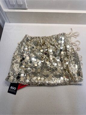 EGO Gold Sequin Drawstring Mini Skirt with Disc Embellishments cut out on side